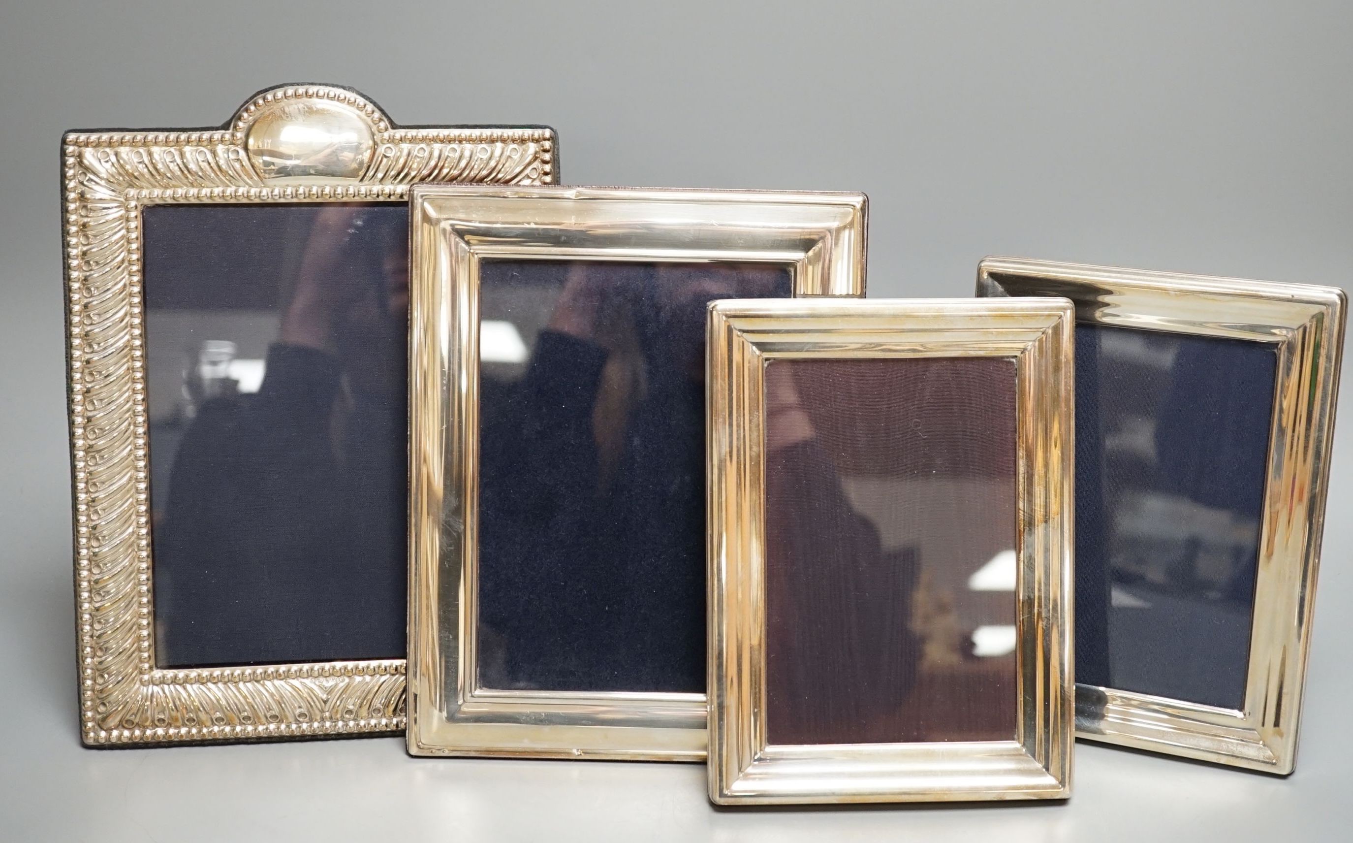 Seven assorted modern silver mounted photograph frames including a pair by JD Ltd, Birmingham, 2000, largest frame, 25.6cm